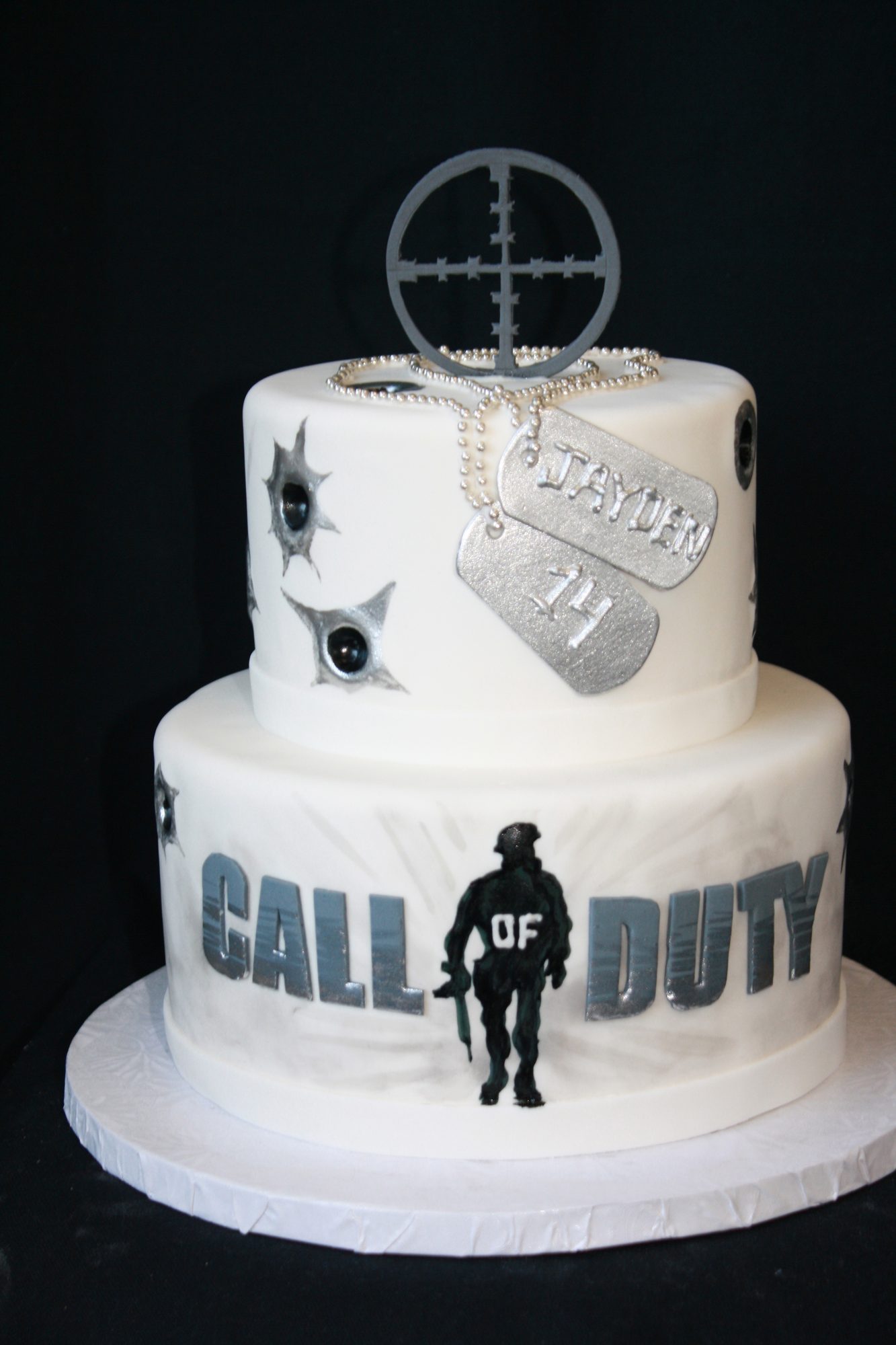 Call of Duty birthday cake with dog tags and crosshairs